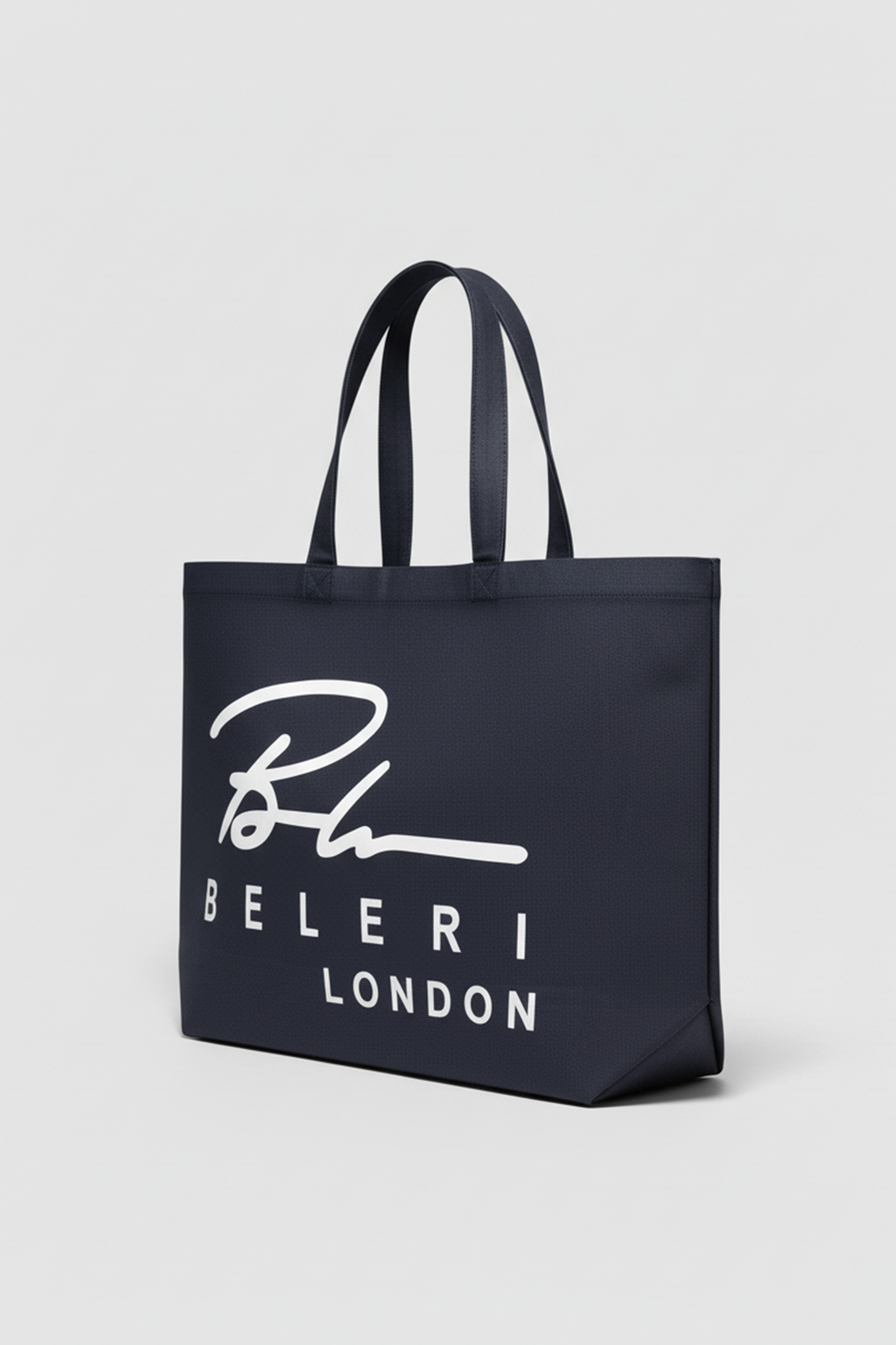 Jet black Beleri London tote bag with white script logo, angled side view