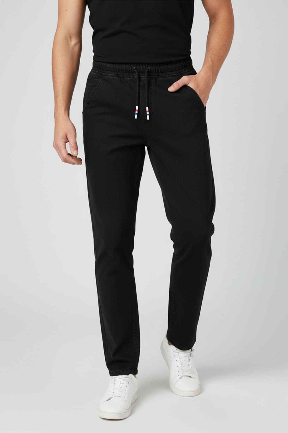 Black jogger pants with elastic waistband, drawstring, and side pockets