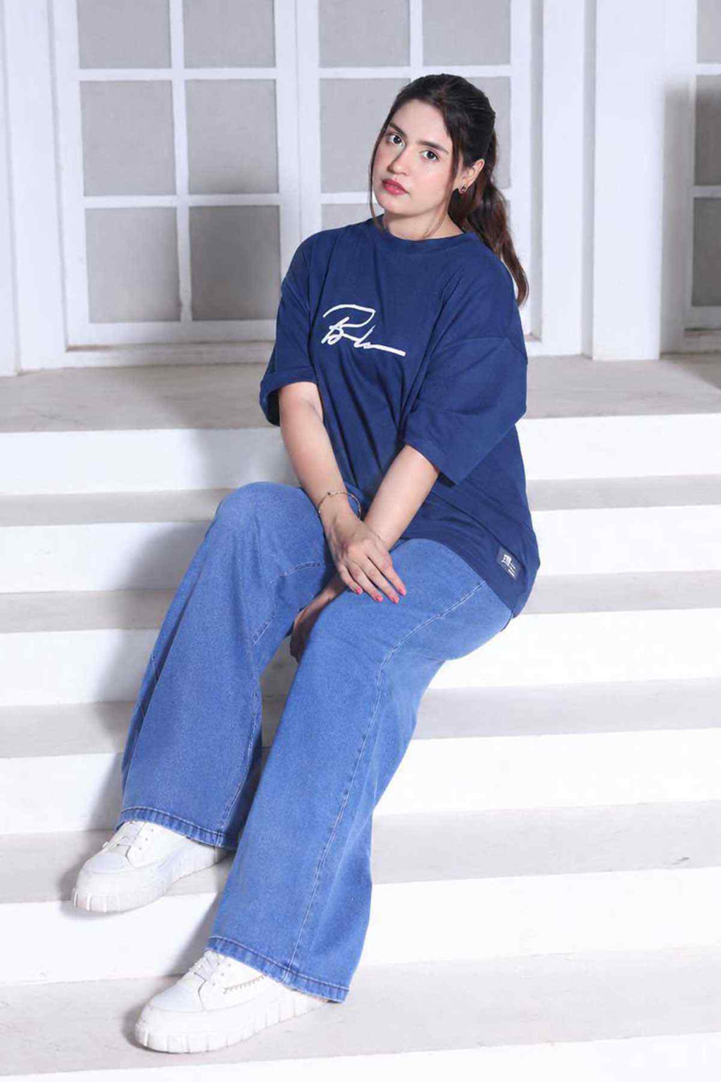 Denim blue T-shirt and light blue wide-leg jeans set with white sneakers