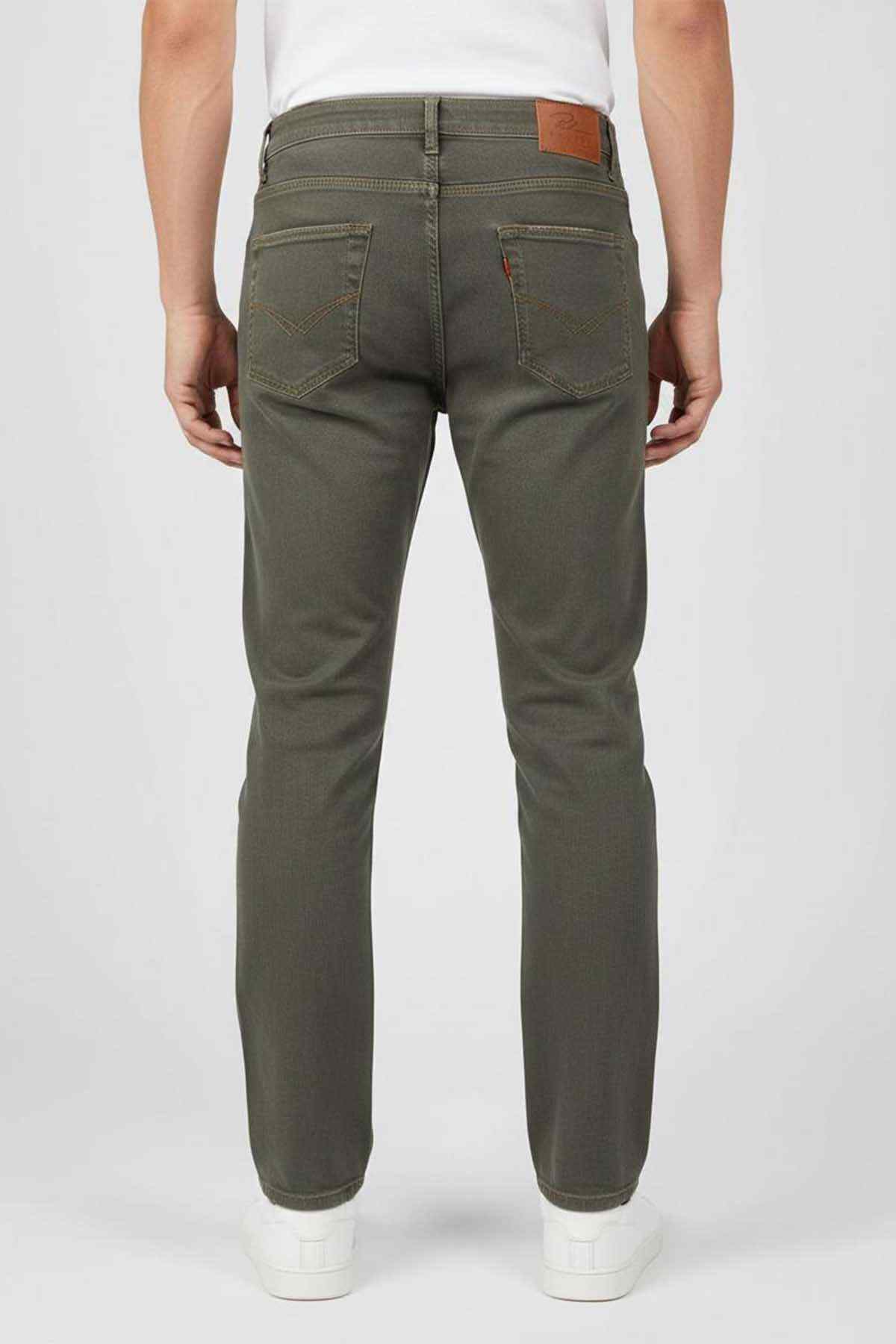 Olive green denim jeans, rear view, tapered leg and five-pocket style