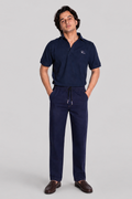 Navy blue polo shirt with logo and drawstring jogger pants