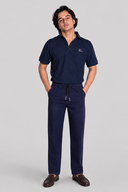 Navy blue polo shirt with logo and drawstring jogger pants