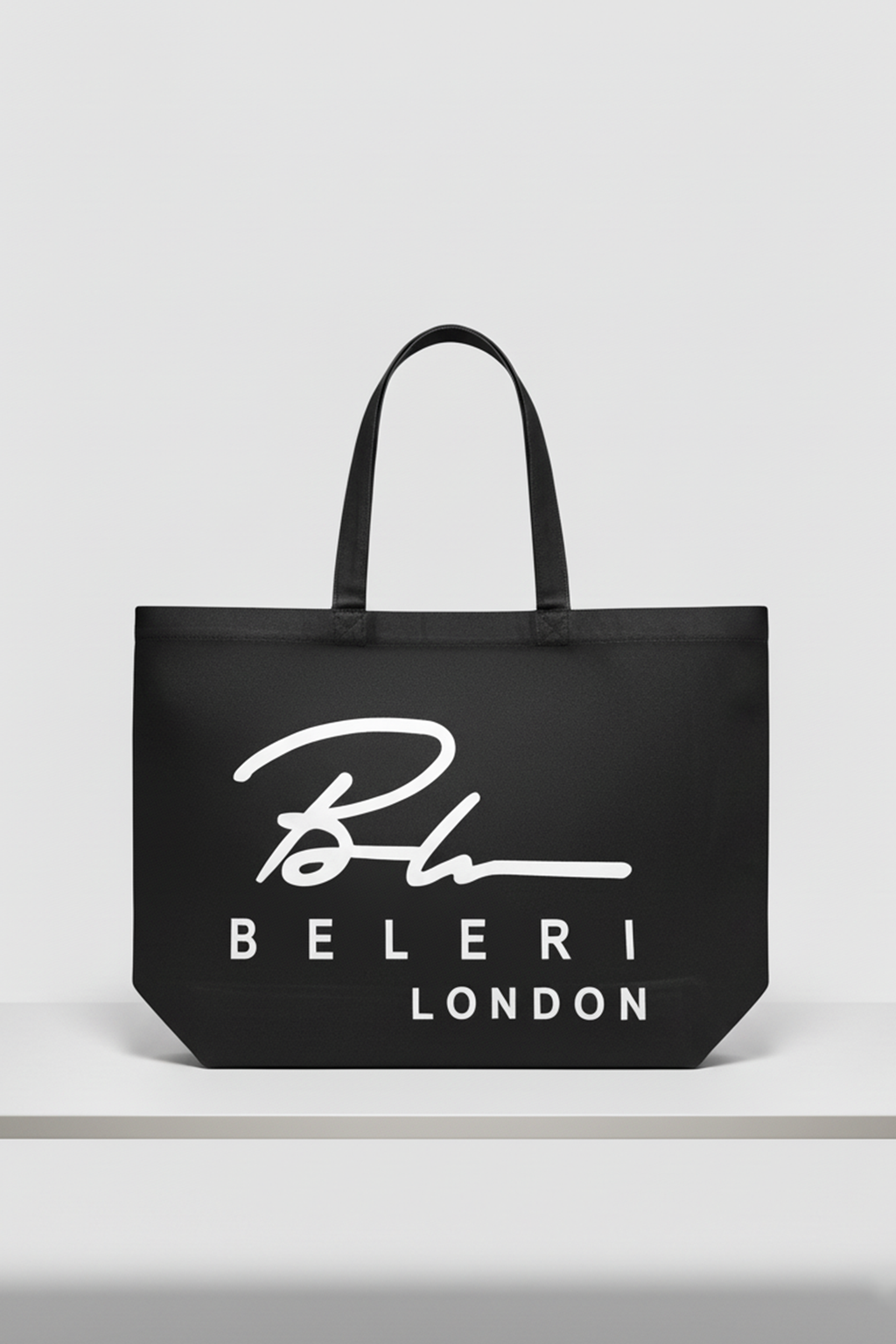 Jet black Beleri London shopping tote with white logo, open top and handles
