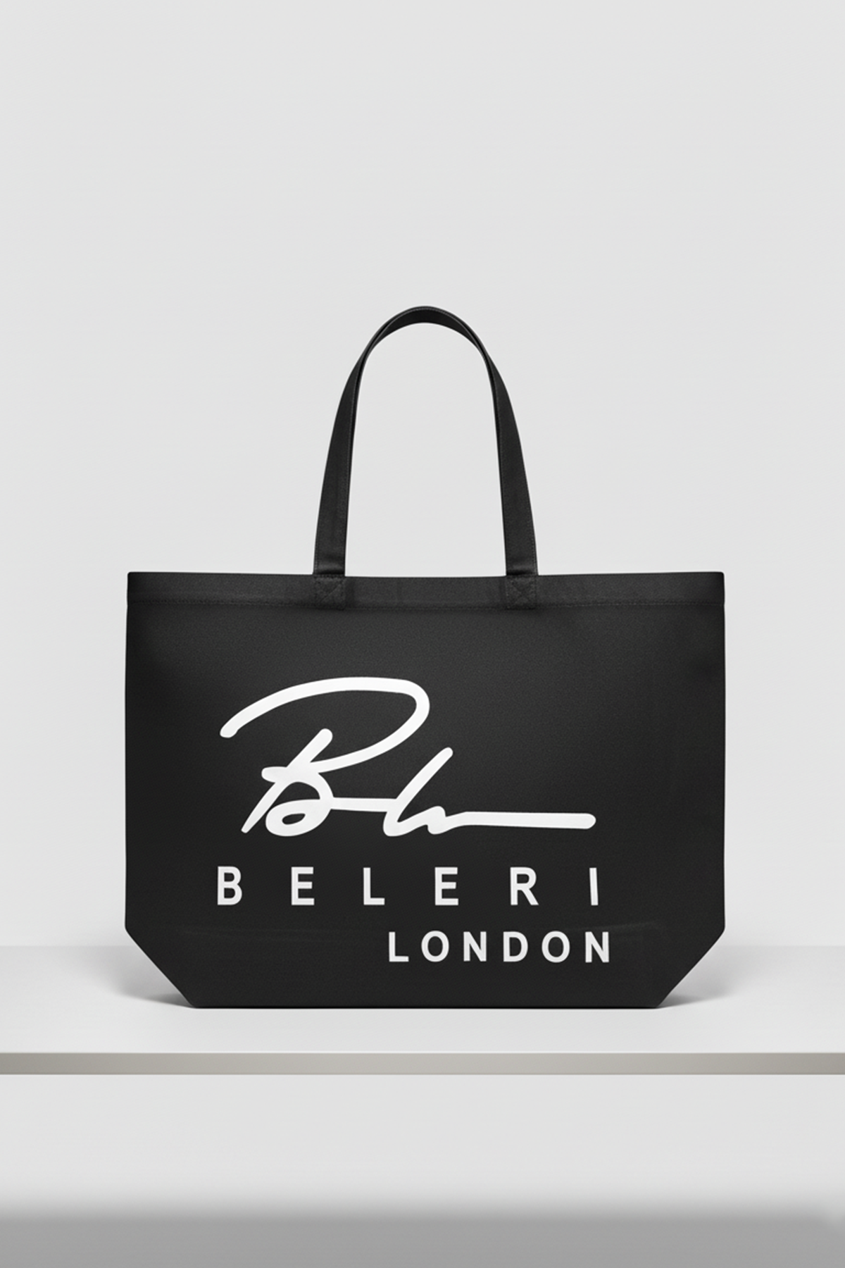 Jet black Beleri London shopping tote with white logo, open top and handles