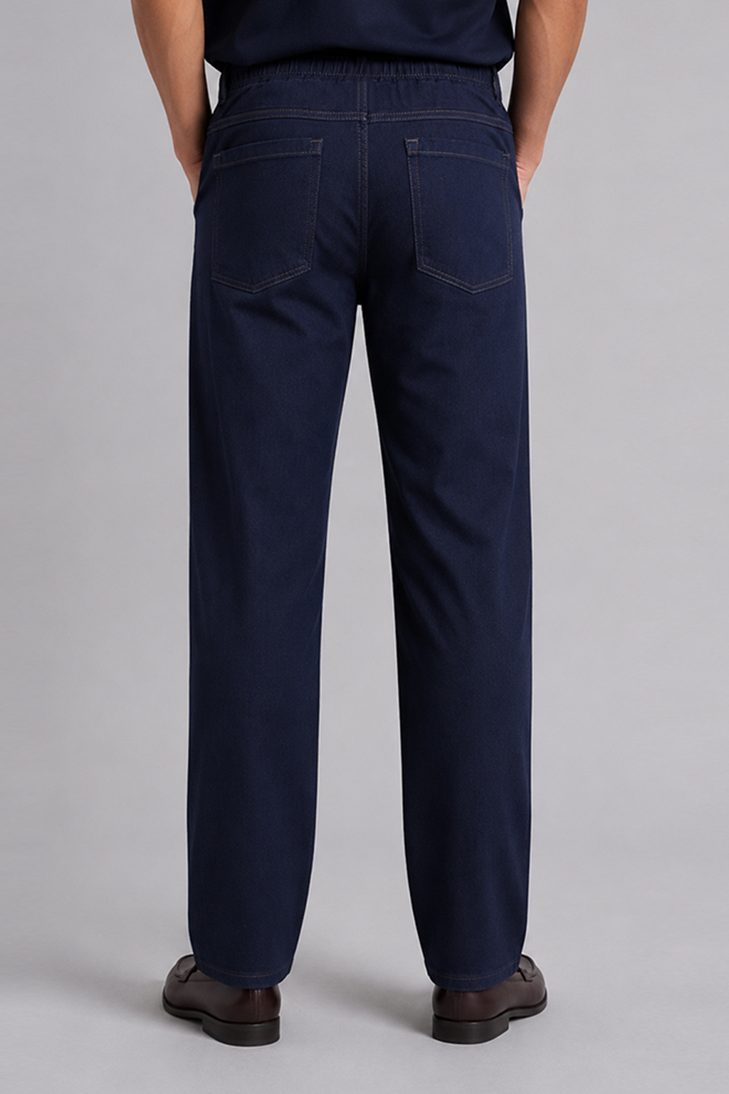 Navy blue straight-leg trousers with front patch pockets and stitched seams